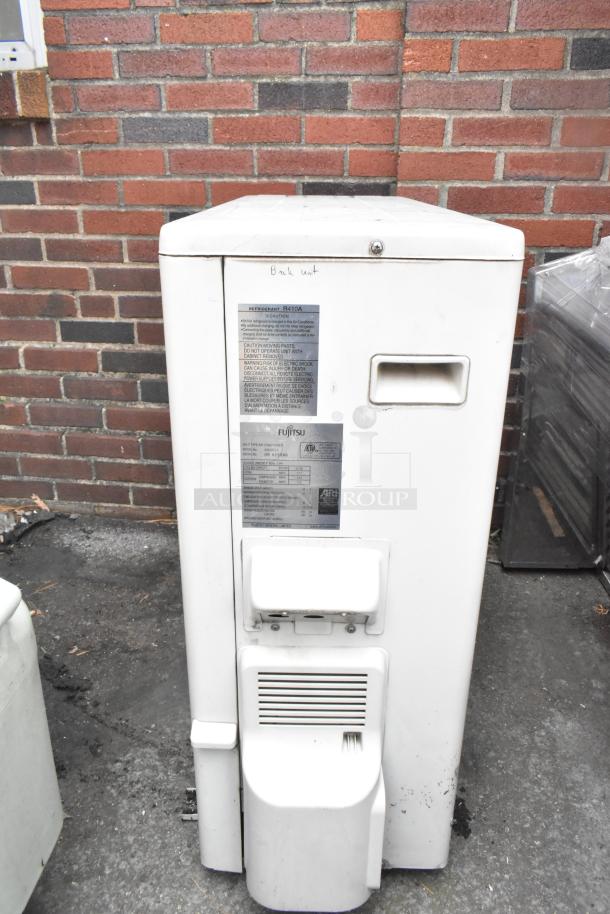 Fujitsu AOU36CLX metal split type air conditioner, 208/230 volts, 1 phase, 33,100 BTU. Visible labels indicate model and power details.