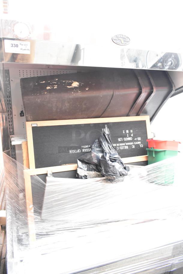 Marc Metal Commercial Grab N Go Merchandiser with contents, wrapped in plastic, showing wear. Includes sign and containers.