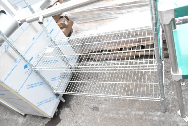 Chrome finish 2-tier wire shelving unit, metal construction, sturdy design, ideal for storage, new condition.