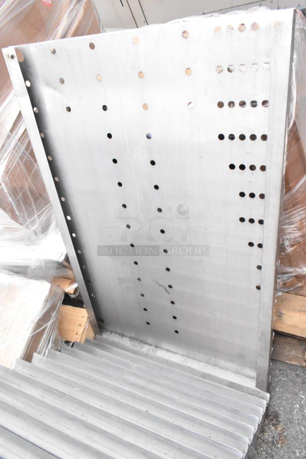 Two perforated metal panels in good condition. Multiple evenly spaced holes. Ideal for industrial use or DIY projects.