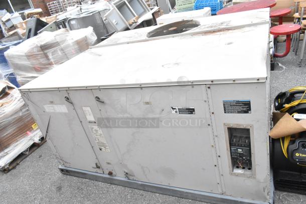 Lennox SGA036H4BT1G metal commercial condenser, 480V, 3 Phase. Visible labels show model and electrical specifications. Surface wear.