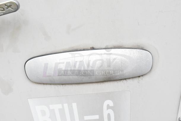 Lennox SGA036H4BT1G condenser nameplate on metal casing, showing logo and model details. 480V, 3-phase unit.