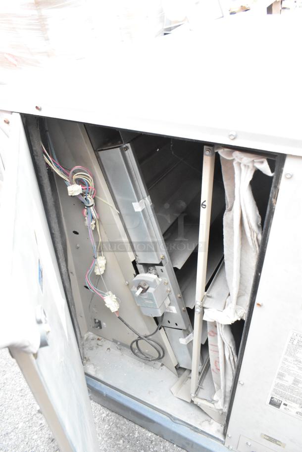 Lennox SGA036H4BT1G metal condenser, 480V, 3-phase, visible wiring, access panel open, commercial heating/cooling use.