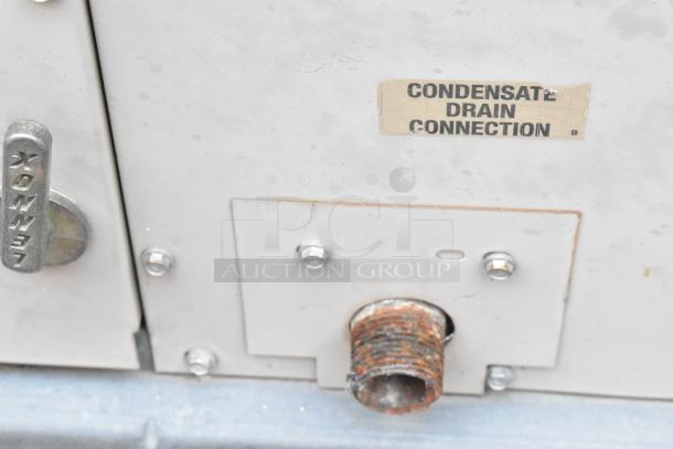 Lennox SGA036H4BT1G condenser metal panel with "CONDENSATE DRAIN CONNECTION" label and Lennox handle, 480V, 3 Phase.