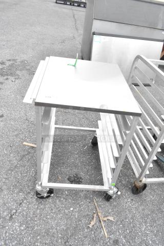 Regency 600upr6wtels 6 Pan Aluminum Bun Pan Rack, stainless steel top, side channels, casters, excellent condition.