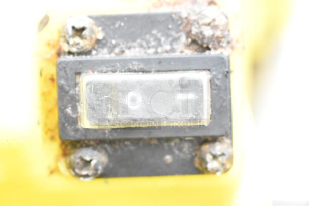 Switch on a Dayton air mover fan, metal screws visible, slight rust noted.