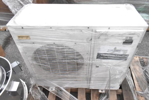 Emerson XFAM-037X-TFC-081 metal split type air conditioner, 208-230 volts, 3 phase, wrapped, with visible model label.