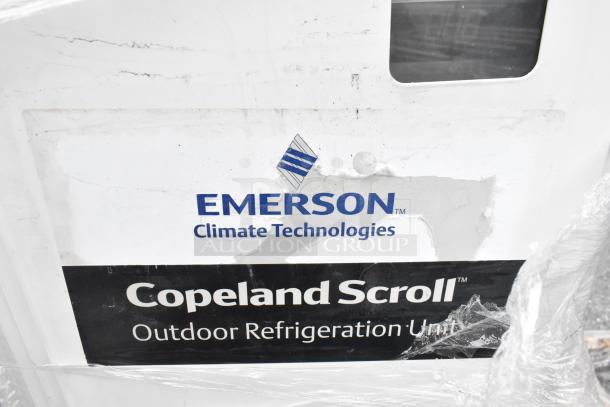 Emerson XFAM-037X-TFC-081 split air conditioner, 208-230V, 3-phase, metal unit. Label shows Emerson Climate Technologies.