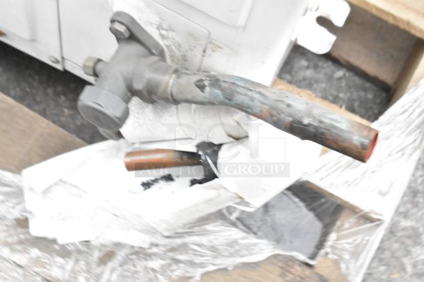 Emerson XFAM-037X-TFC-081 split type air conditioner, metal housing, 208-230V, 3 phase, visible wear on pipes.