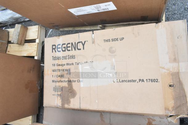 Cardboard box labeled "Regency Tables and Sinks," 18-gauge work table model 600TB1836G. Box appears unopened.