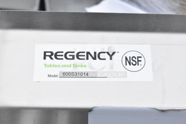 Regency Tables and Sinks label with NSF certification and model 600S31014 on stainless steel, indicating new scratch and dent condition.
