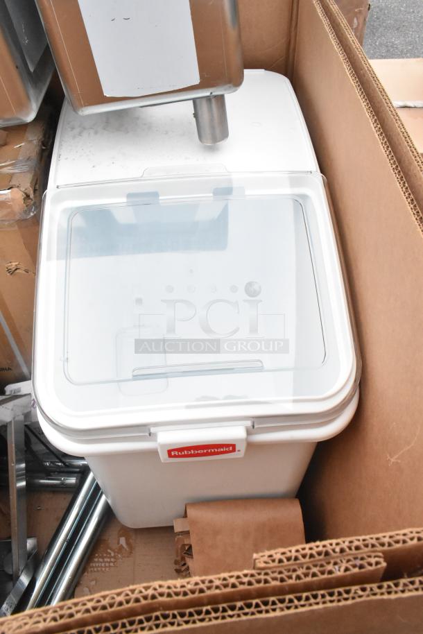 Rubbermaid ingredient bin with clear lid, seen in a cardboard box. Brand new, scratch and dent condition.