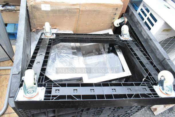 A set of 8 brand new scratch and dent items including a sink, mop sink, and dolly, featuring plastic frames and caster wheels.