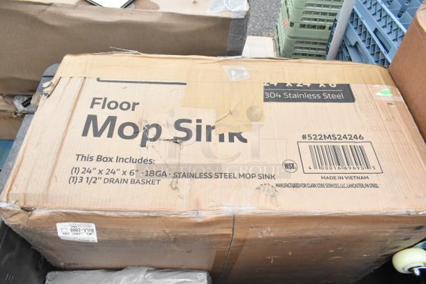Cardboard box labeled "Floor Mop Sink," 24"x24"x6", 18GA Stainless Steel, with minor wear, includes a 3.5" drain basket.