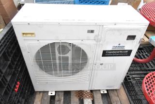 Emerson XFAM-037Z-TFC-081 split-type AC unit, 208-230V, 3-phase, exterior view. Features "Copeland Scroll" label.