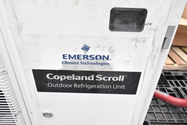 Emerson air conditioner model XFAM-037Z-TFC-081, 208-230V, 3 phase, metal split type. "Copeland Scroll" label visible.