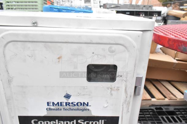 Emerson XFAM-037Z-TFC-081 metal split air conditioner, 208-230V, 3 phase, visible wear, Copeland Scroll logo on casing.