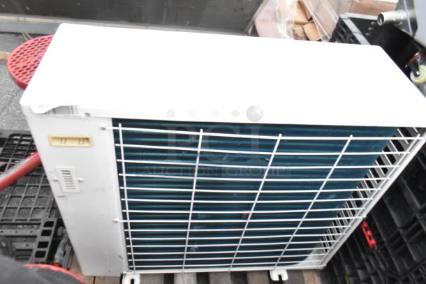 Emerson XFAM-037Z-TFC-081 metal split type air conditioner, 208-230V, 3 phase, white exterior, metal grille, used condition.