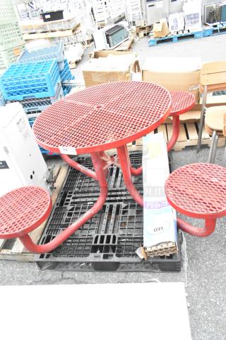 Red metal round table set with attached seats, includes LED light pack. Good condition, lot tag visible.