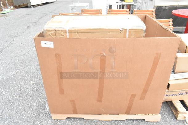 Large cardboard box containing 2 new items: Regency 3' clean dish table with left drainboard and Steelton 30"x36" work table.