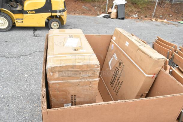 Boxes containing brand new Regency 3' Clean Dish Table with left drainboard and Steelton 30"x36" Stainless Steel Work Table.