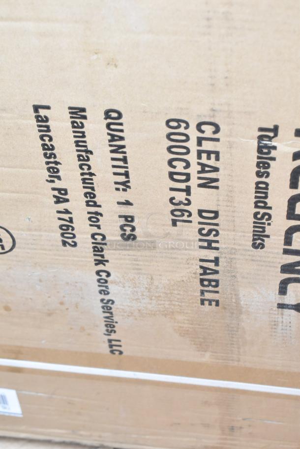 Cardboard box labeled "Clean Dish Table 600CDT36L," Regency, Lancaster, PA. New, scratch and dent condition.