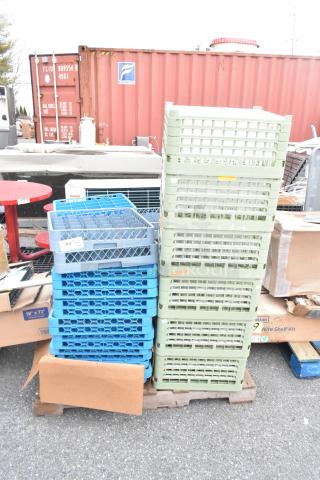 Lot of various items including green and blue dish caddies on pallet, visible labels showing size and description.