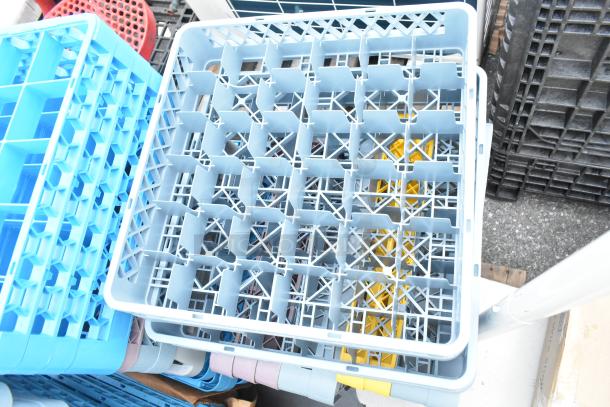 Lot of various plastic dish caddies in assorted colors and sizes, stacked. Good condition. Ideal for kitchen use.