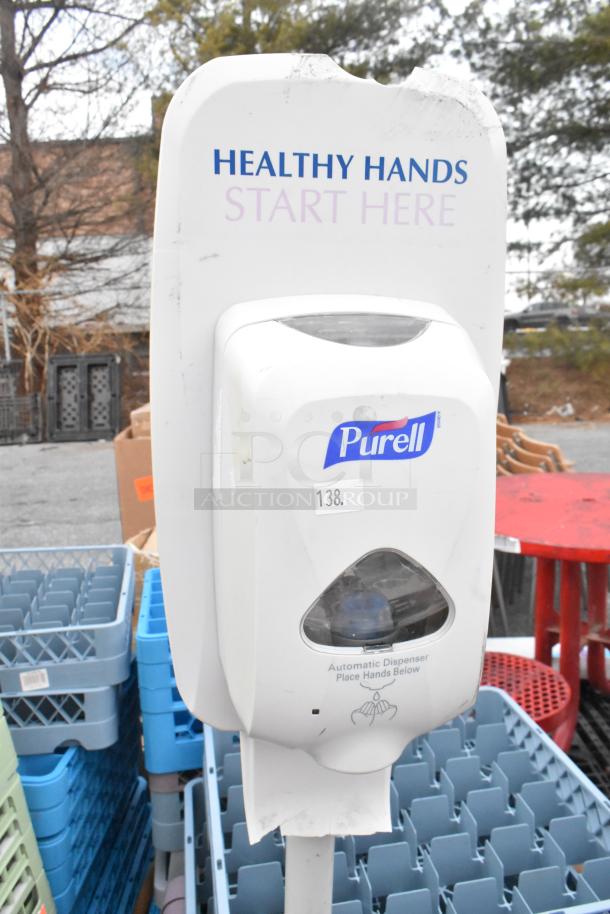 Lot including Purell hand sanitizer dispenser on stand, labeled "Healthy Hands Start Here," surrounded by dish caddies.