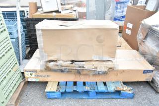 Cardboard boxes on a wooden pallet, marked with "Steelton 24"x72" Wire Shelf Kit," possibly containing new items.