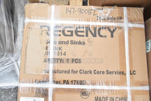 Regency sink box, new, labeled "Clark Core Services." Signs of wear include scratches and dents. Quantity: 1 piece.