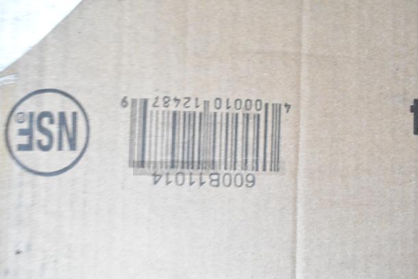 Cardboard box with visible barcode and NSF logo, representing auction item of 3 new scratch and dent pieces, including sink and rack.