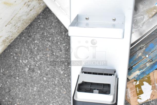 Pallet lot of various items, including a metal rack and stainless steel pieces on wooden pallets, moderate wear visible.