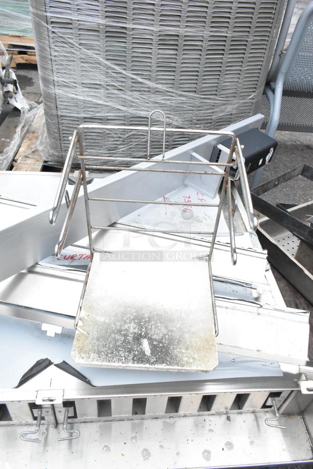 Pallet lot with stainless steel pieces, metal rack, and various industrial items. Possible wear shown.