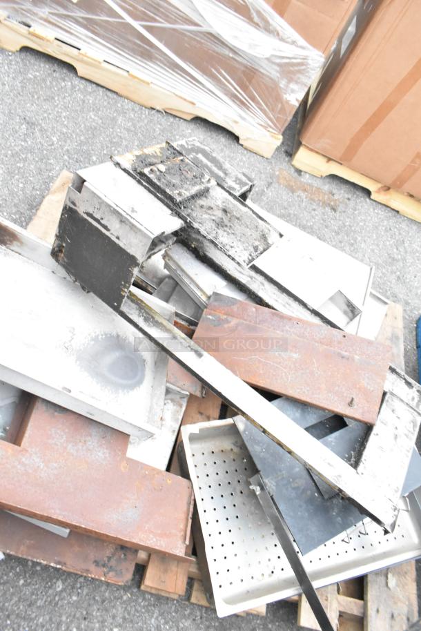 Pallet lot of various metal items, including stainless steel and rusty pieces, on a wooden pallet, used condition.