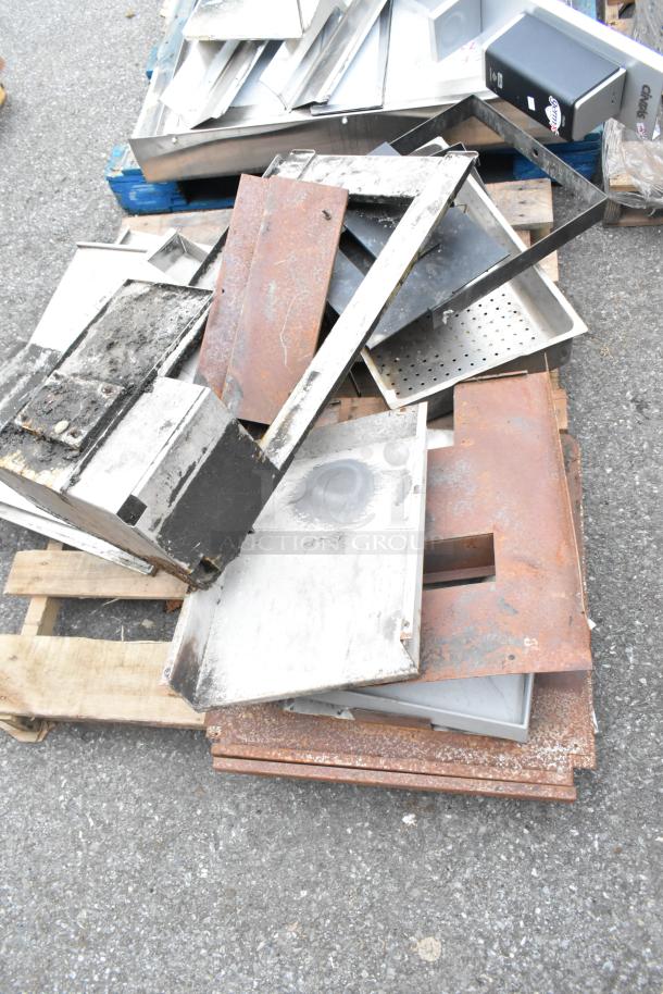 Pallet lot of various stainless steel and metal pieces in mixed condition, featuring assorted panels and frames.