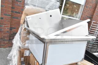 Stainless steel sink by Steelton, new with minor scratches, part of an 8-item auction bundle.