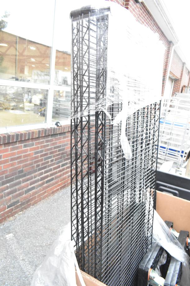 Brand new wire shelves, part of an 8-item scratch and dent auction bundle. Wrapped for protection, visible in exterior setting.