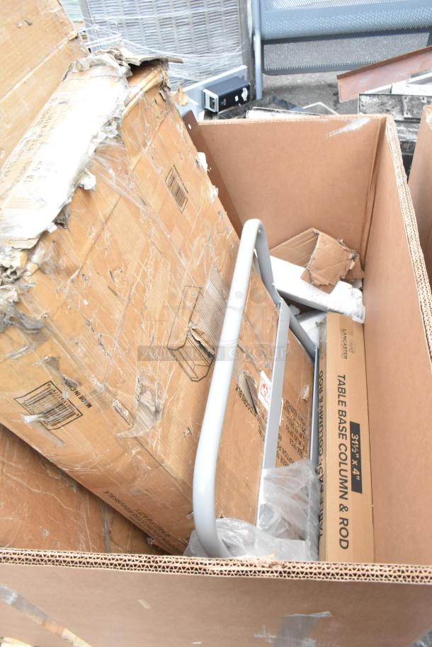 Cardboard box with visible wear contains new items: host station and dispenser. Includes "Table Base Column & Rod" packaging.