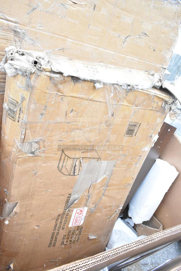 Damaged cardboard box containing 6 brand new scratch and dent items, including a host station and dispenser. Box shows wear.