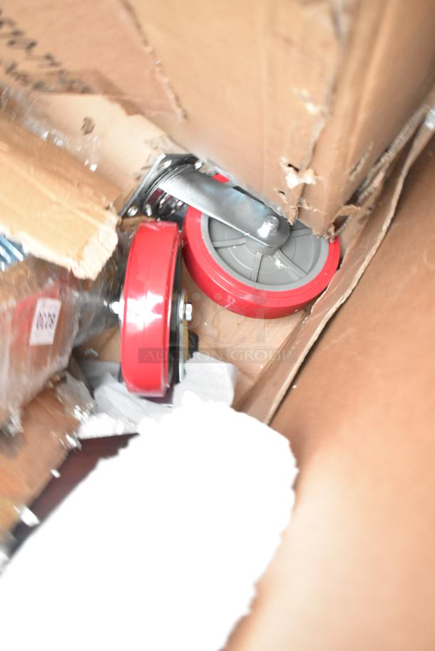 New scratch and dent items in box, visible red caster wheels and bracket. Includes host station, dispenser.