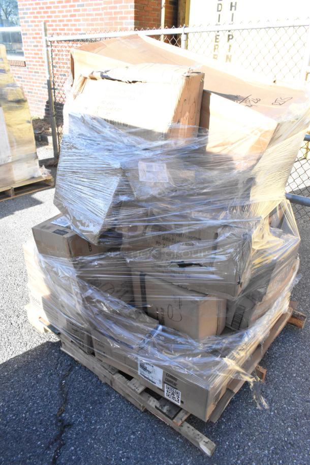 Pallet with 22 boxed kitchen items, labeled "Scratch and Dent," includes charcuterie board, glasses, grater, plates.