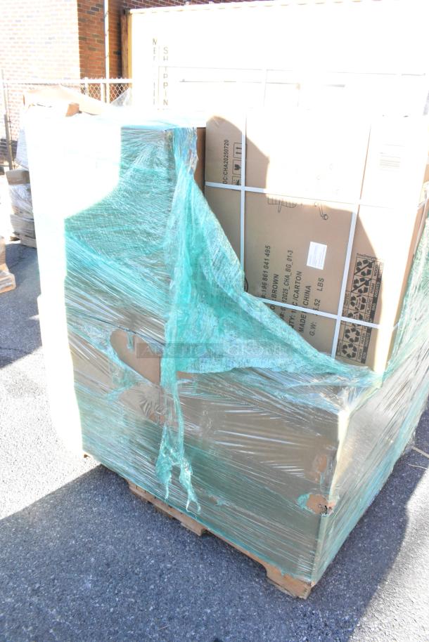 Pallet of 8 new but scratch and dent items, wrapped in green plastic, including Martha Stewart Taytum office chair box.
