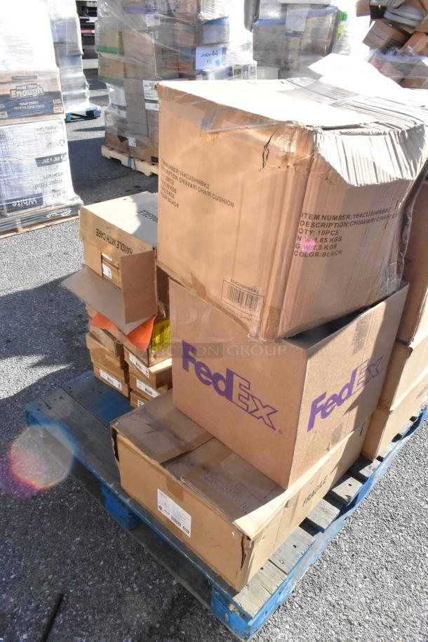 Stacked cardboard boxes on a pallet, labeled FedEx and Chiavari Chair Cushion, showing signs of damage.