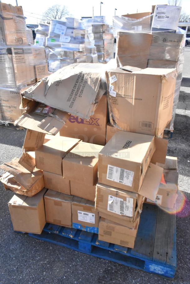 Pallet with 25 new scratch and dent boxes, including vacuum pouches, cushions, shipping labels visible.