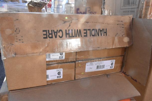 Cardboard boxes labeled "HANDLE WITH CARE" and "Made in China." Visible Dual Lite logo and product details on some boxes.