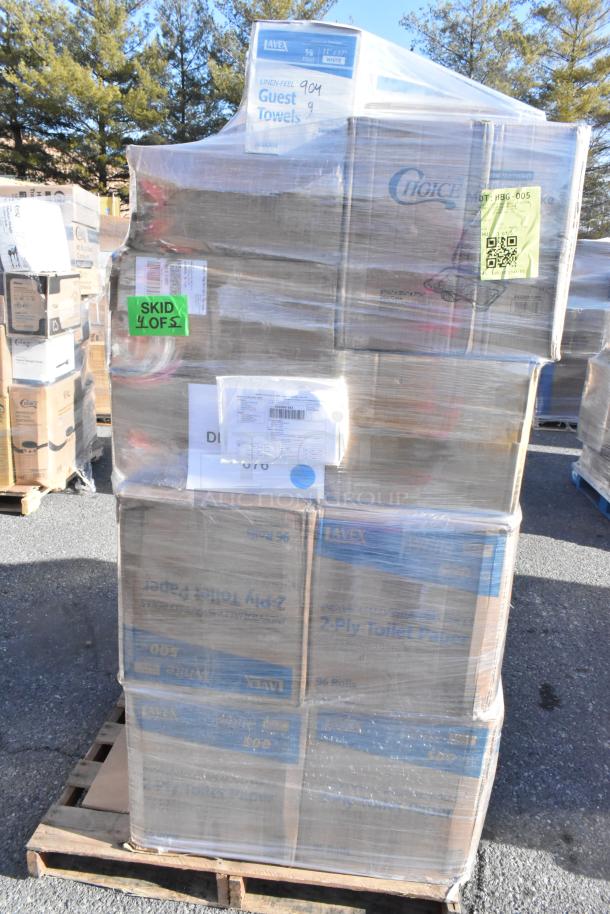 Pallet of 26 brand new scratch and dent items including hand wipes, containers, and cold cups. Visible labels show "Guest Towels" and "2 Ply Toilet Paper."