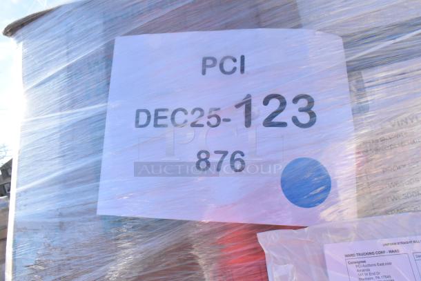 Pallet of 32 assorted new scratch and dent items, including butcher paper, lids, trash bags, and plates. Visible labels show "PCI DEC25-123 876."