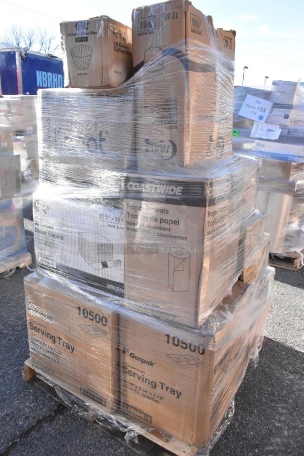 Pallet of 24 scratch and dent items including Coastwide towels, Genpak trays, and Karat napkins, wrapped in plastic.
