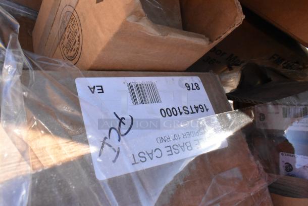 Auction lot with 28 scratch and dent items, including stock pot, cutting board, glasses. Boxes labeled with item codes and markings.